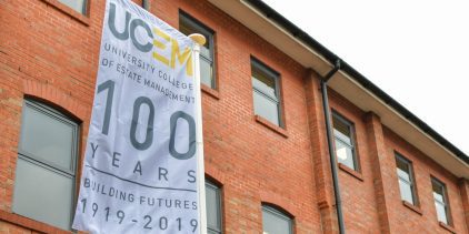 UCEM Centenary flag outisde of the UCEM office