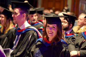A happy graduand at the December 2019 UCEM Graduation