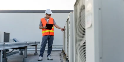 Building Services Engineer in hard hat and high vis