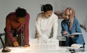 Architects discussing model. University of the Built Environment
